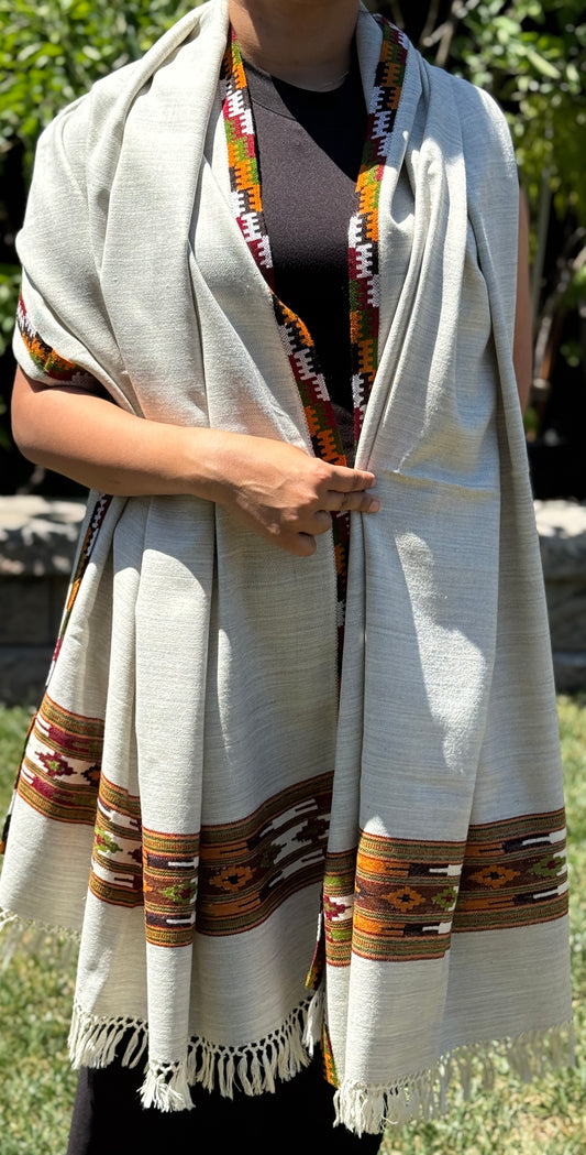 Handmade sheep wool white patterned shawl with colorful borer.